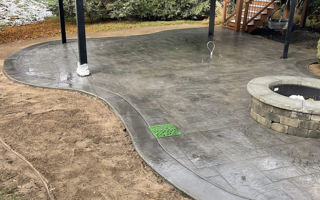 Custom concrete patio by OAX Construction in Kalamazoo